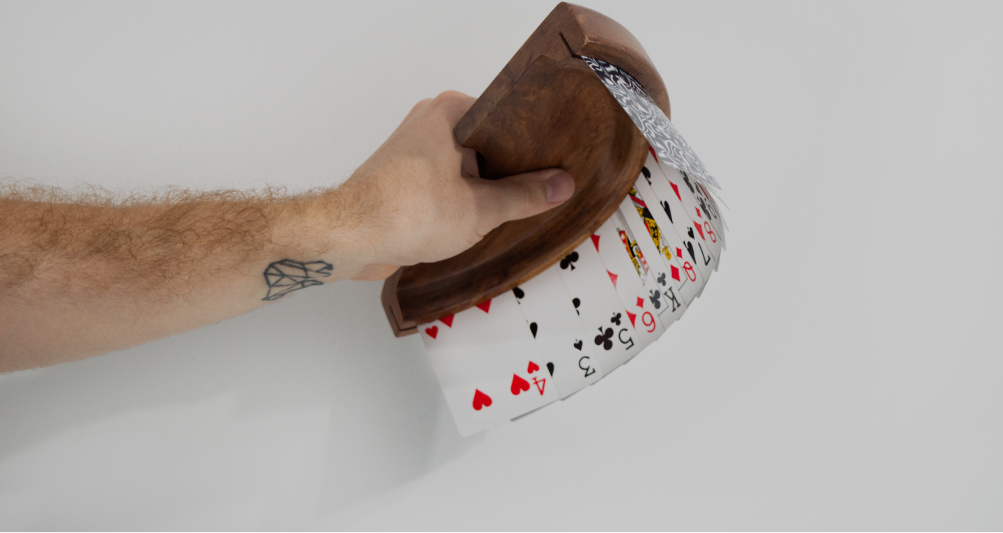 Hand holding card holder with cards