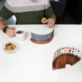 Load image into Gallery viewer, A person hodling coffee and cookie while playing cards with the card holder